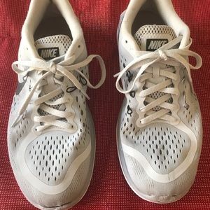 Women’s grey and white Nike athletic shoes size 9